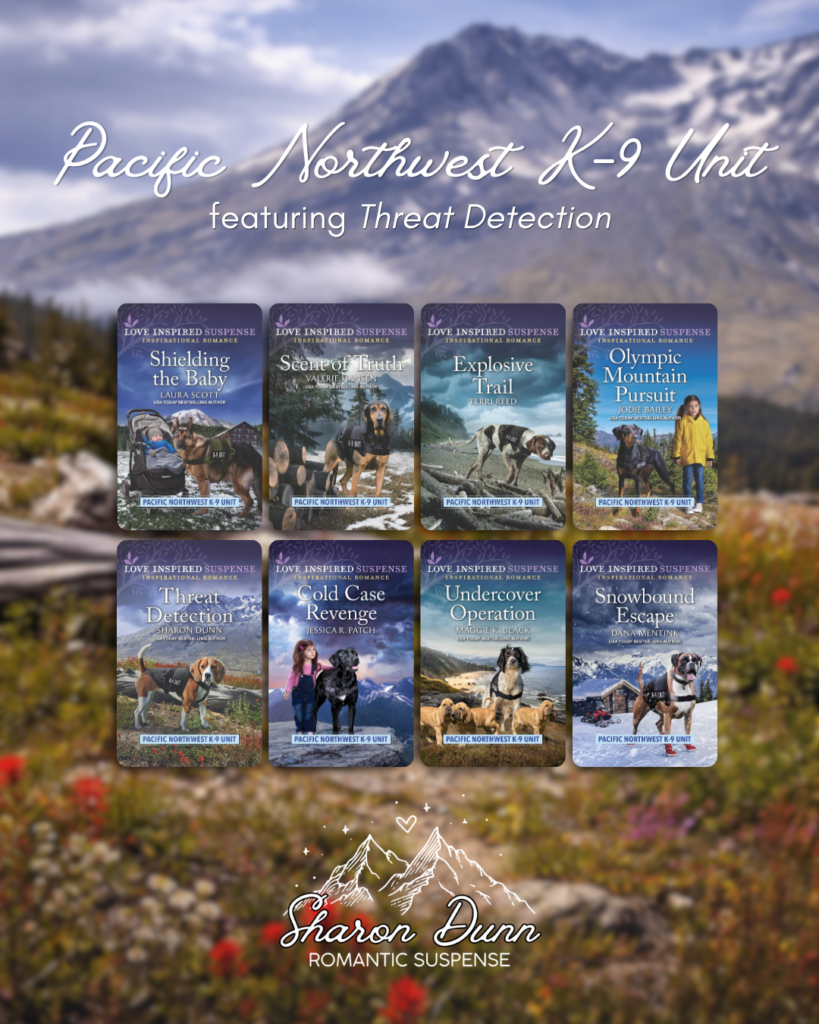 A collection graphic for the Pacific Northwest K-9 Unit romantic suspense continuity from Love Inspired Suspense, featuring eight book covers. The image spotlights Threat Detection by Sharon Dunn, which is book five in the series and features a Beagle K-9 at Mount St. Helens. The graphic displays all eight covers in a grid, from Shielding the Baby to Snowbound Escape, against a blurry mountain meadow backdrop with red wildflowers and snow-capped peaks.